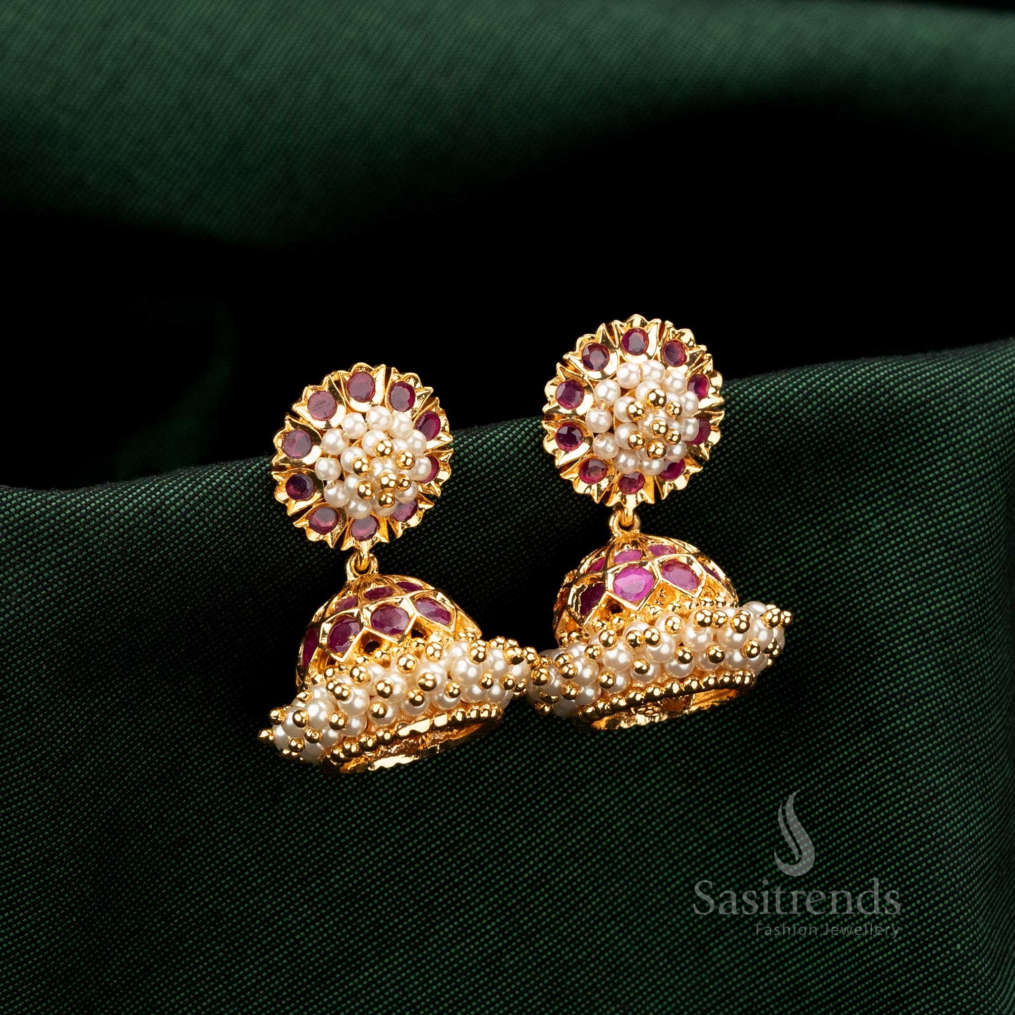 Traditional American Diamond gold plated Jhumka earrings featuring sparkling Ruby AD embellishments - Sasitrends