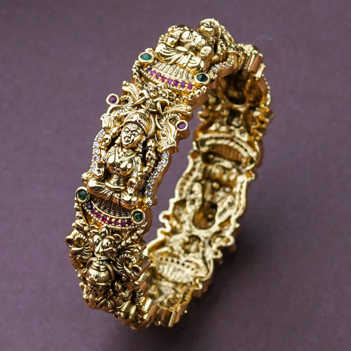 Divine Goddess: Temple Matte Gold Plated Peacock Bridal Lakshmi Kada Bangle, an Emblem of Beauty and Grace