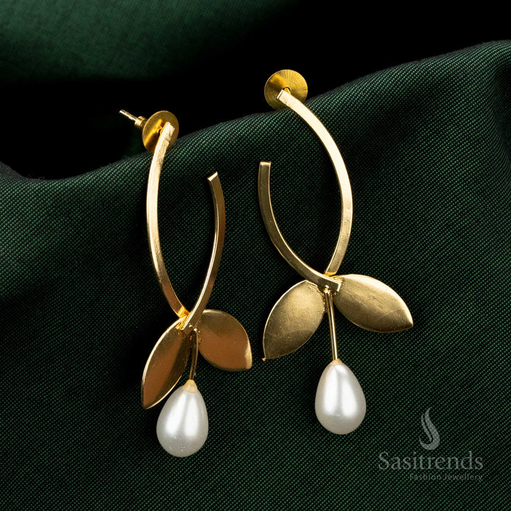 Festive gold-plated earrings featuring a unique leaf-inspired design and pearl drop - Sasitrends