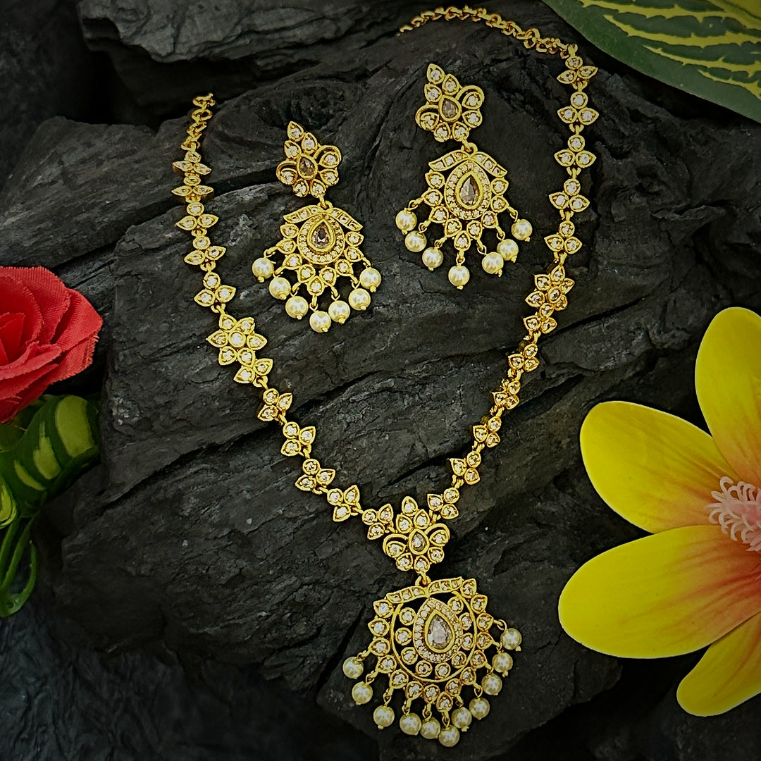 Captivating Matte Gold Plated Floral AD Necklace Set in White Colored Stones.