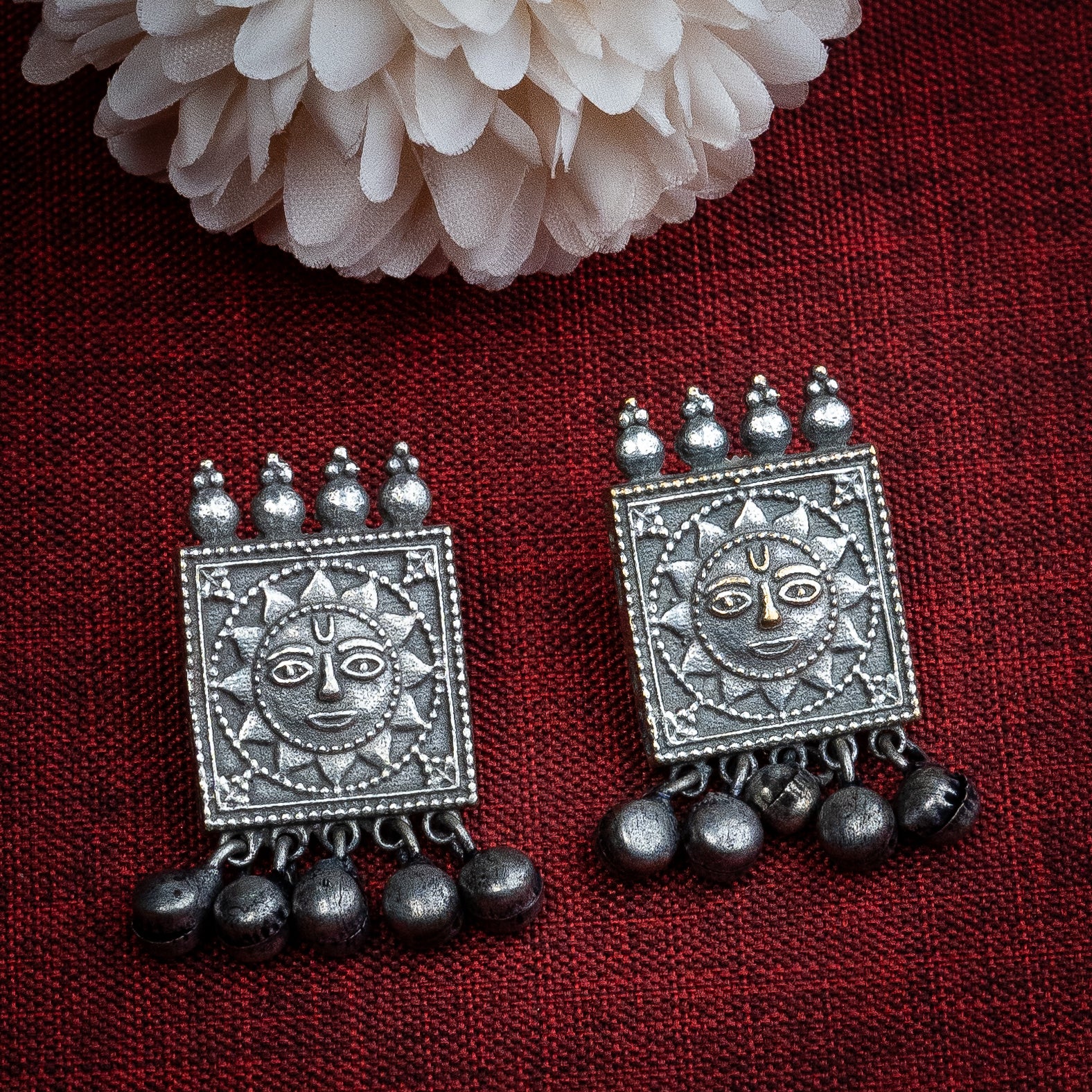 Chic oxidised silver earrings with tribal Sun face motif - versatile fashion accessories for any occasion.