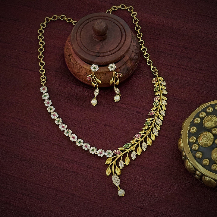 Stunning Party Wear Temple Gold Plated Necklace Set with Multi-Colored Stones - Floral & Leaf Pattern, Ideal for Weddings