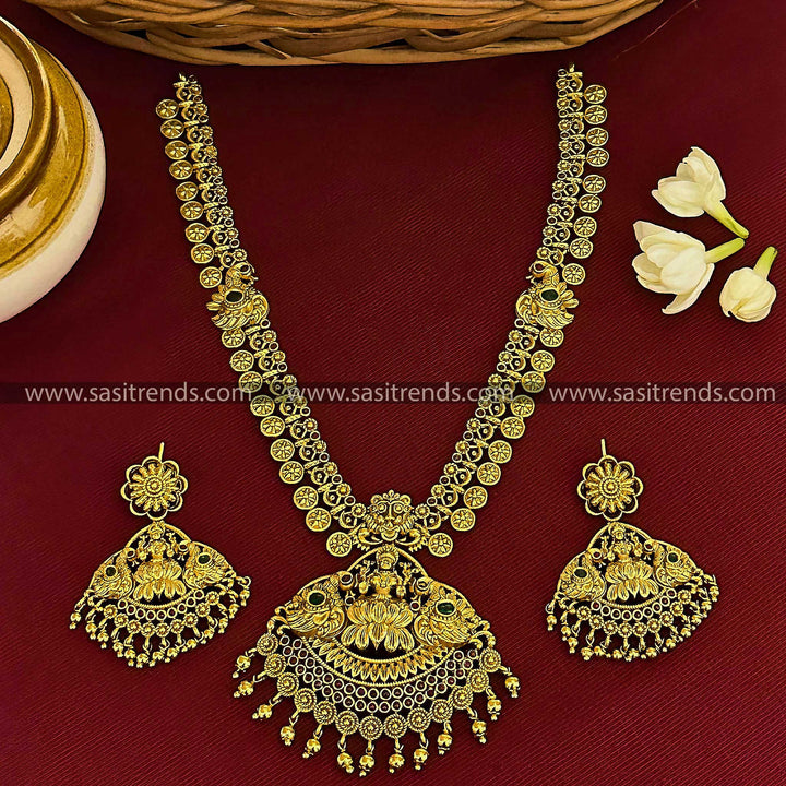 Divine Wealth: Bridal Lakshmi & Peacock Pendant Temple Matte Gold Finish Long Jewellery Set with AD Stones | Sasitrends