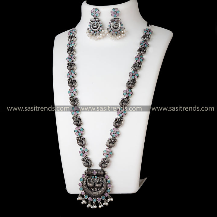 Trendy Oxidised German Silver Necklace Set with Peacock Chandbali Pendant and Pink-Mint Stones