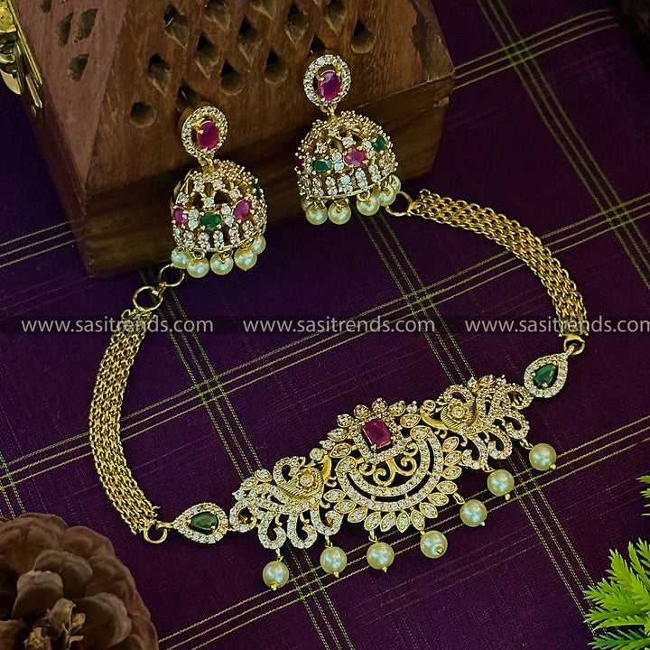 Gorgeous Peacock Motifs Temple Matte Gold Tone Pearl Choker AD Jewellery Set with Jhumkas | Sasitrends