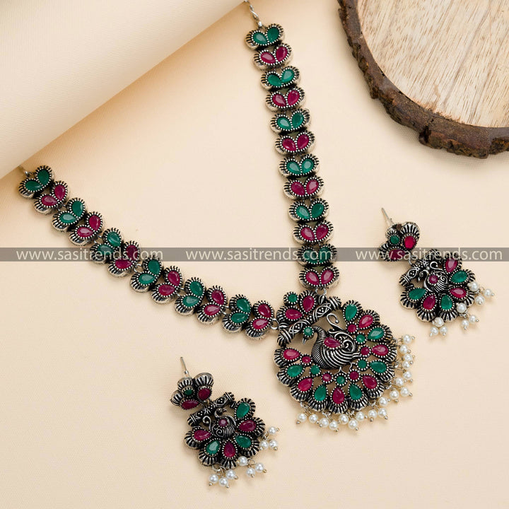 Trendy Party Wear Peacock Oxidised German Silver Necklace Set with Earrings, Ruby-Green Stone Fusion