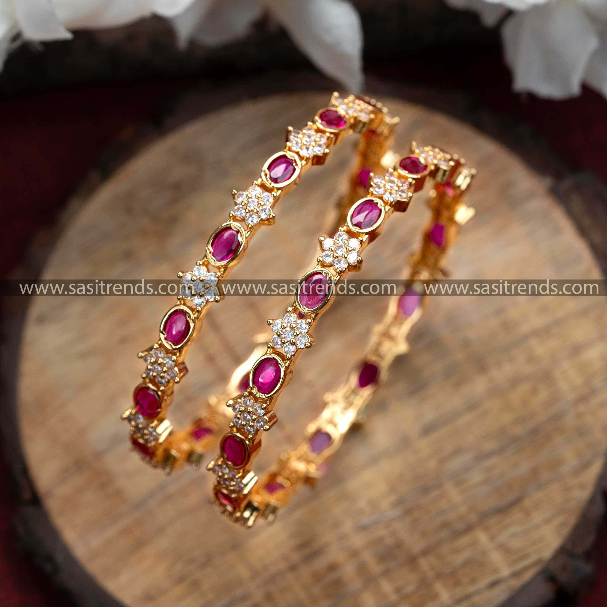 Traditional Oval and Floral Pattern Micro Gold Plated Bangle Pair with Ruby Stones and AD Stones