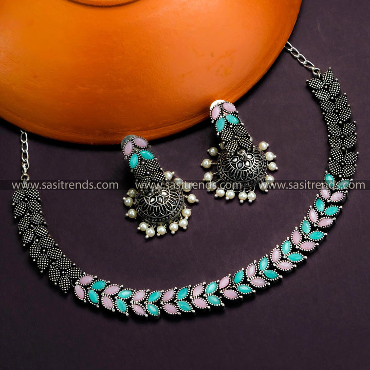 Trendy Party Wear Oxidized German Silver Leaf Necklace with Jhumkas & Mint-Pink Stones - Timeless Beauty for Online Shopping