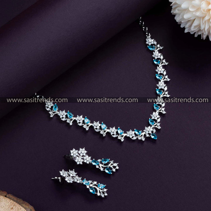 Chic Rhodium Silver Plated Necklace Set in Ocean Blue. Gorgeous Floral Pattern, Studded with American Diamonds