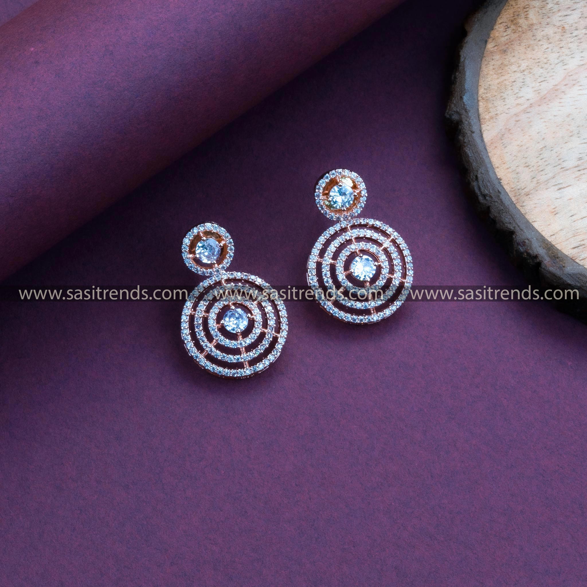 Stylish Party Wear Rose Gold Plated Earrings adorned with White Stones, Circle Pattern, and American Diamonds