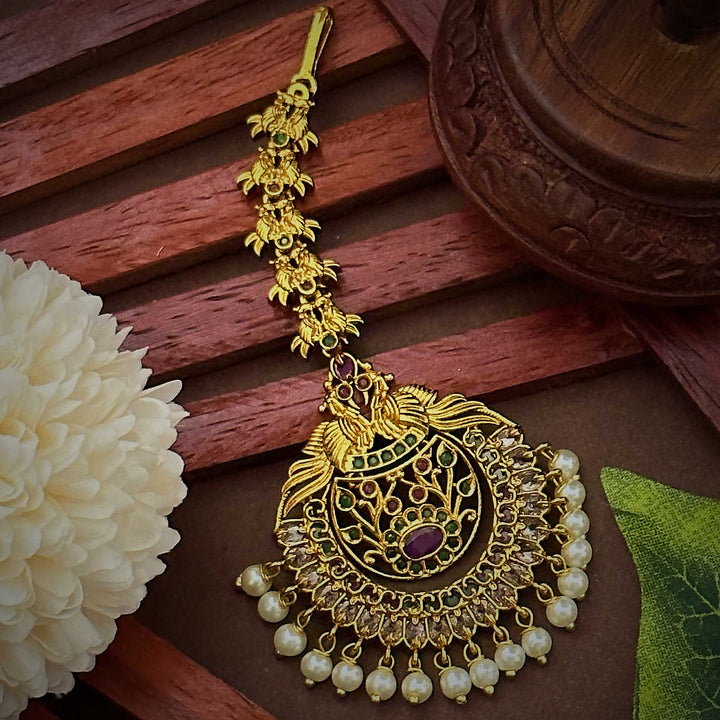 Traditional Bridal Elegance: Peacock Motif Temple Matte Gold Plated Maang Tikka with AD Stones | Sasitrends