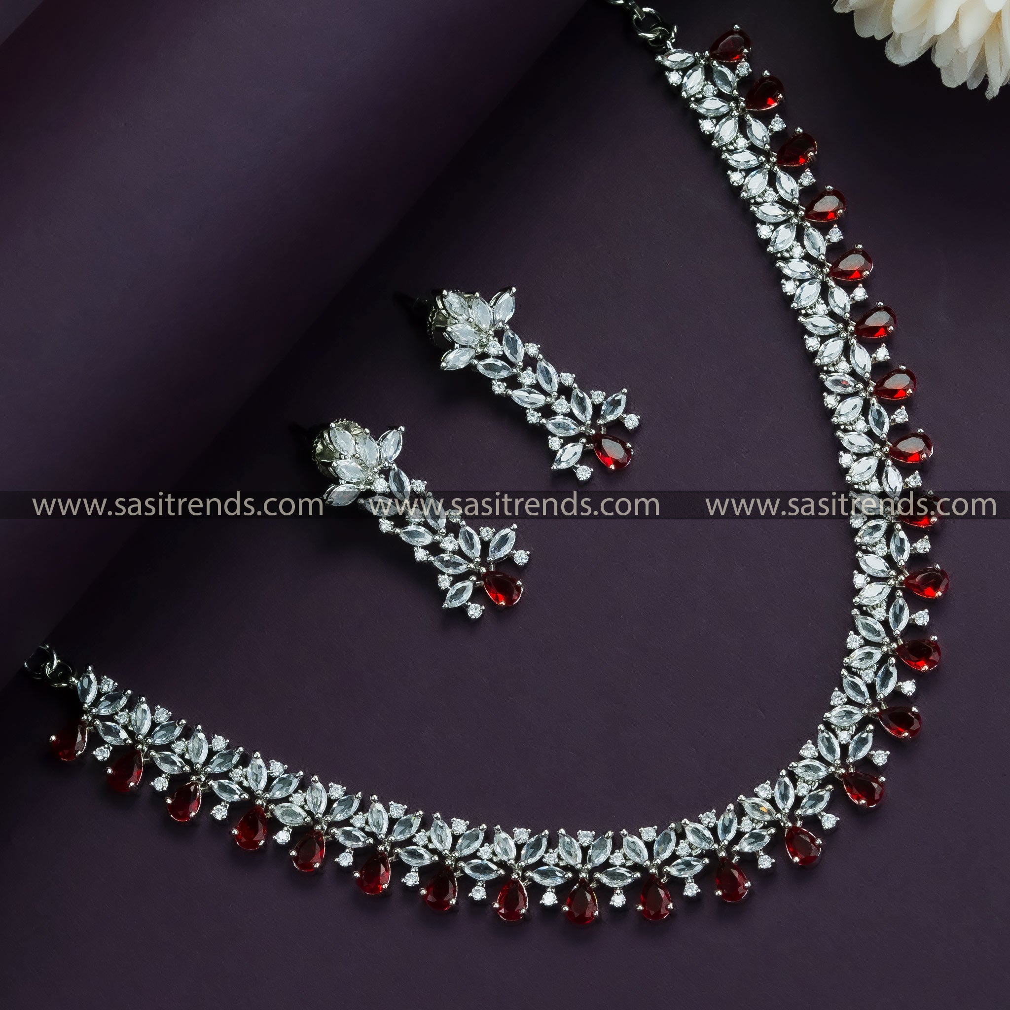 Red Glamour: Rhodium Silver Plated Floral Necklace Set with American Diamond Stones - Party Wear Collection in Red for Women