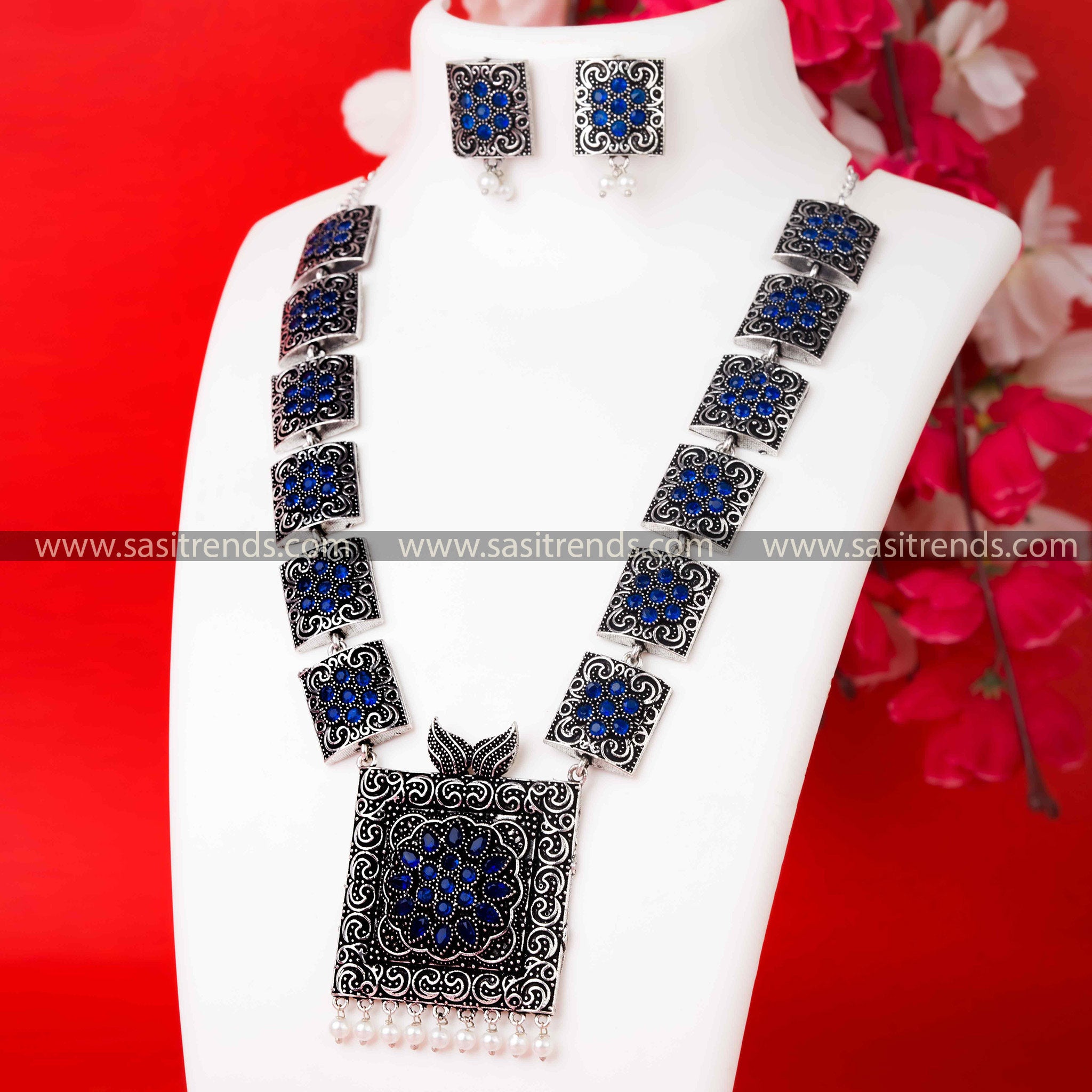  Oxidised German Silver Necklace adorned with Striking Blue Stone Pendant and Complementary Pearl Earrings.