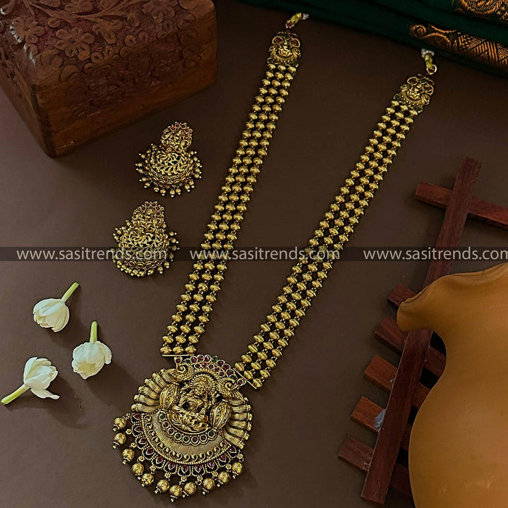 Temple Matte Gold Plated Long Jewellery Set with Three-Layered Bead Lakshmi Peacock Pendant & Matching Jhumkas for Women | Sasitrends