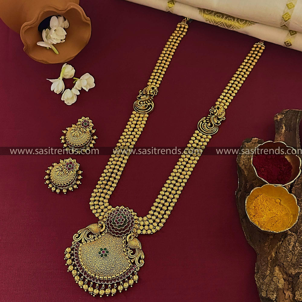 Grand Bridal Traditional Wear Matte Gold Long Necklace Set with Jhumkas - Floral Pendant Design