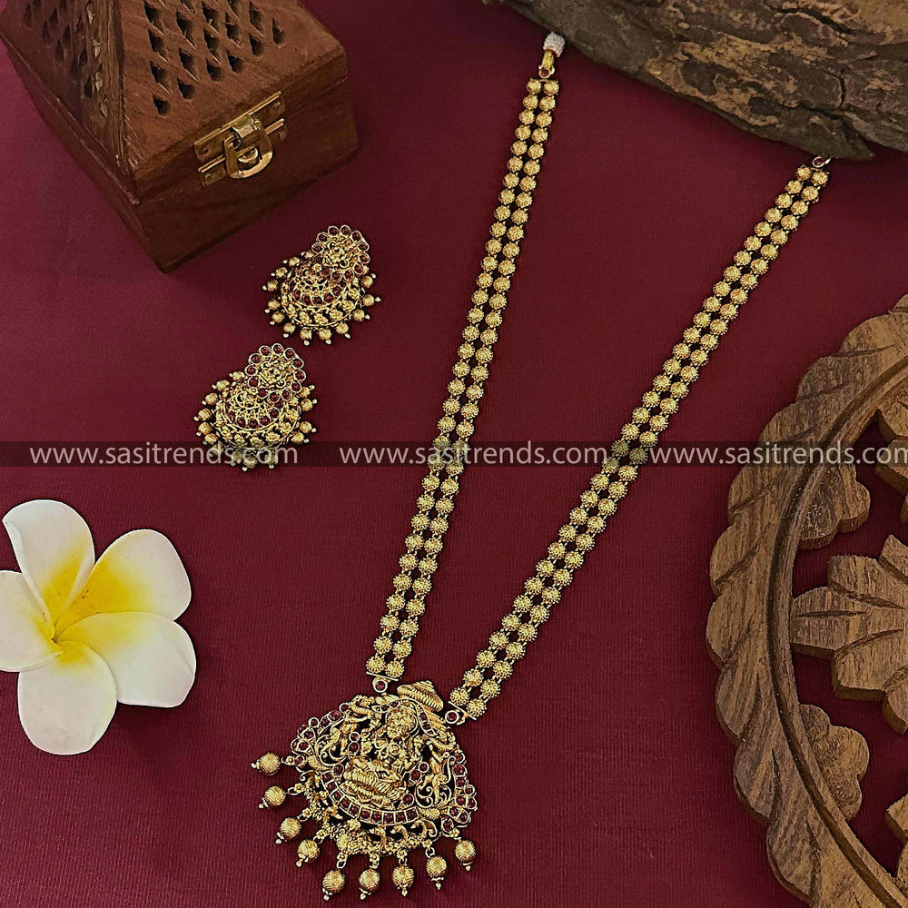 Bridal Long Necklace Set with Jhumkas - Divine Lakshmi Pendant, Full Ruby Color Stone, and Peacock Motifs.