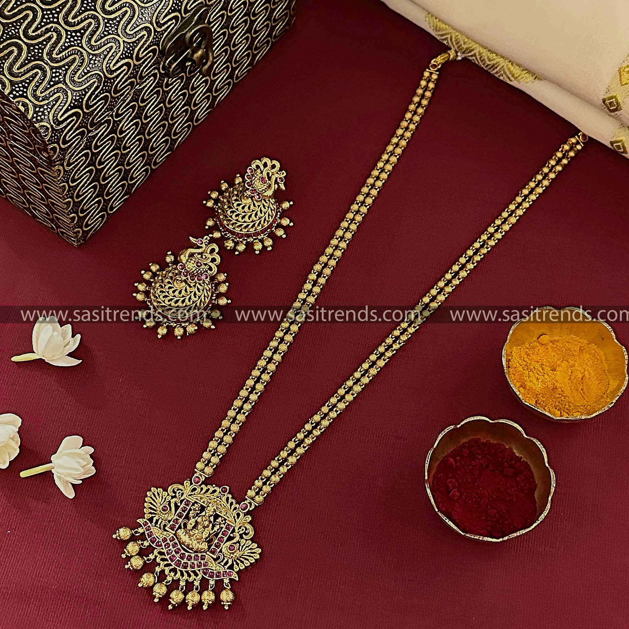 Temple Gold Plated Lakshmi Pendant Long Necklace Set with Radiant Ruby-Colored Stones