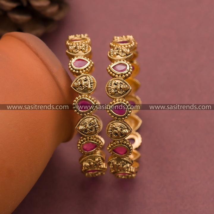 Trendy Matt Gold Plated Lakshmi Motif  Ruby Stone Bangles