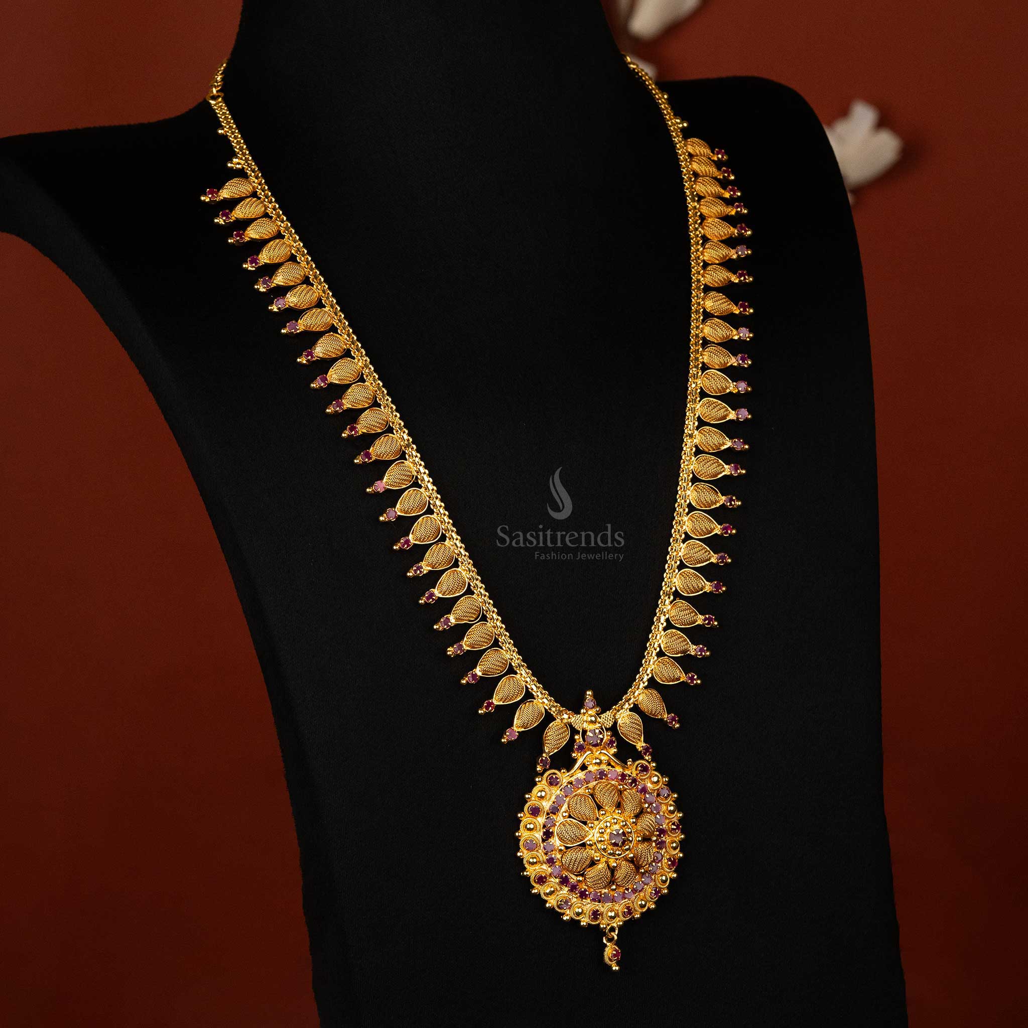 Leaf pattern ruby long haram necklace with floral pendant by -Sasitrends