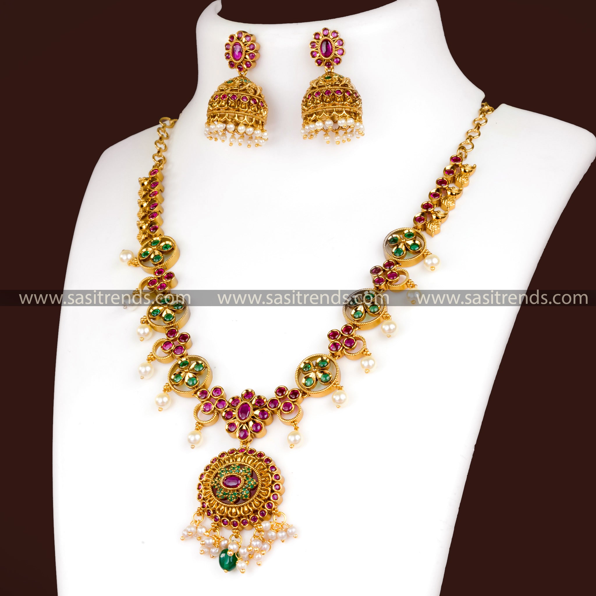 Matte Gold Necklace Set with Ruby Red and Emerald Green Stones - Floral Pendant, Jhumkas, AD Stones, Hanging Pearls