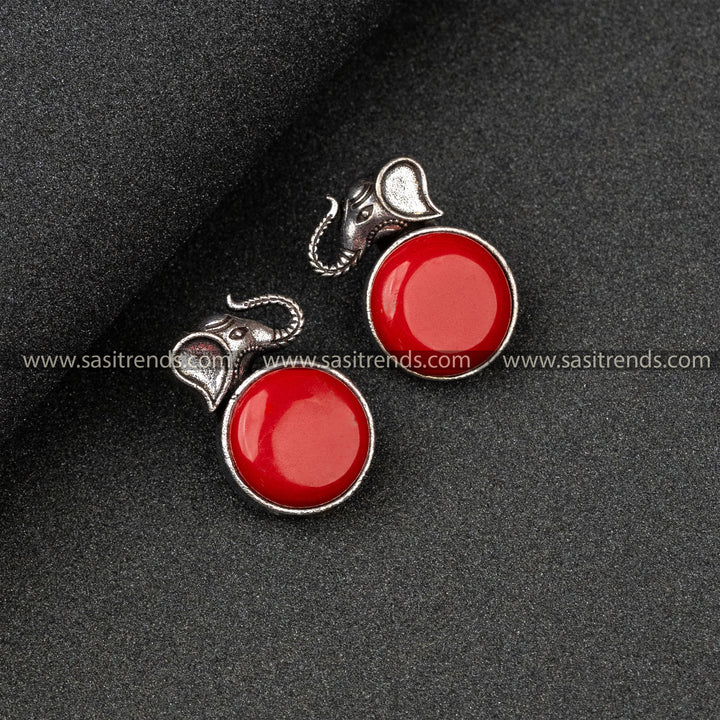 Trendy Oxidised German Silver Elephant Head And Round Monalisa Stone Red Earrings