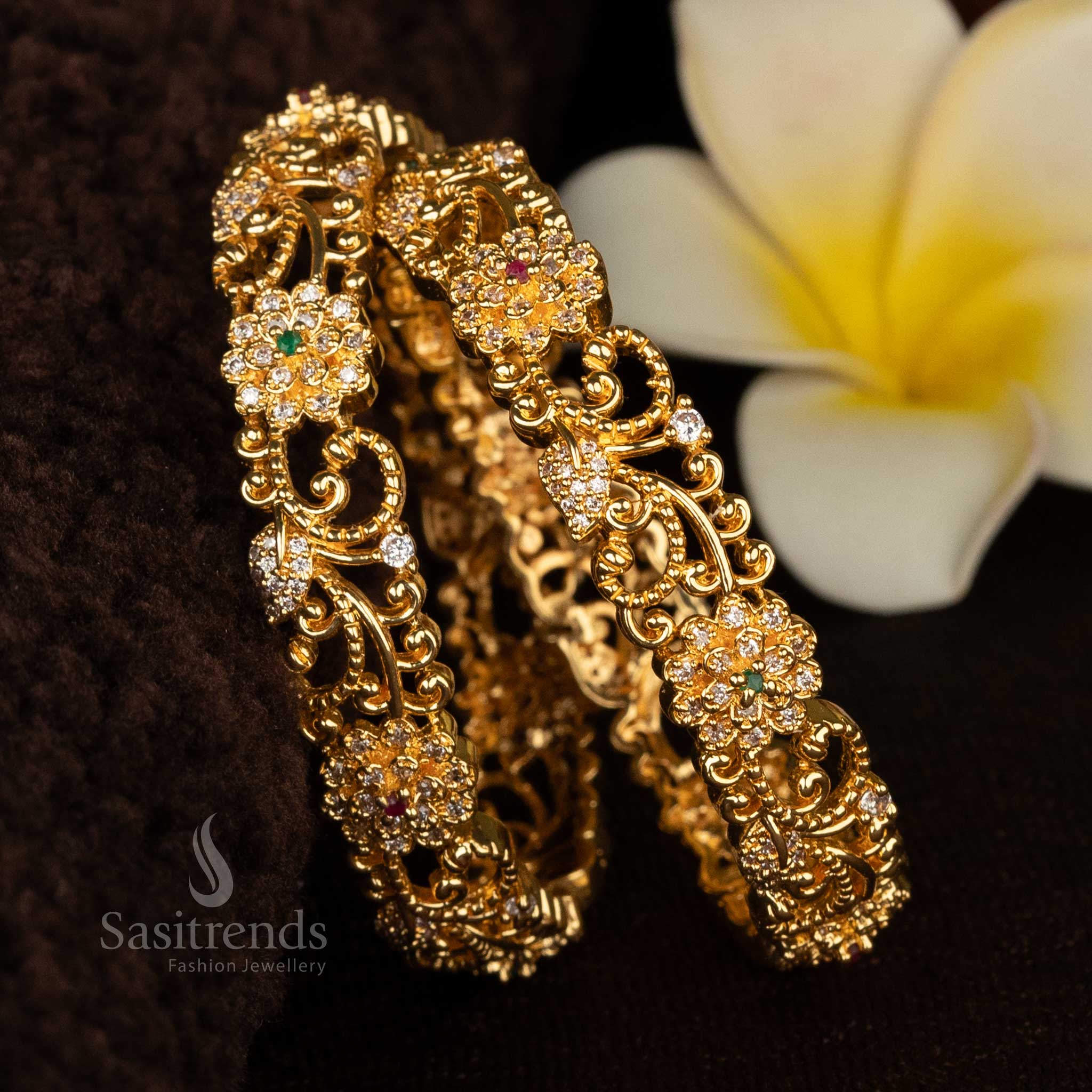 Beautifully crafted floral bangles with gold plating and detailed artistry, perfect for bridal wear and festive celebrations - Sasitrends