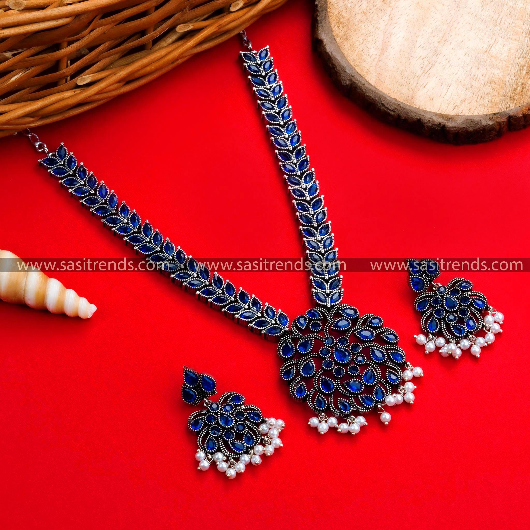 Mesmerizing Navrathri Special Oxidized German Silver Floral Pendant Necklace with Blue Stones