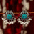Turquoise stone embellished oxidised peacock earrings with pearlescent highlights