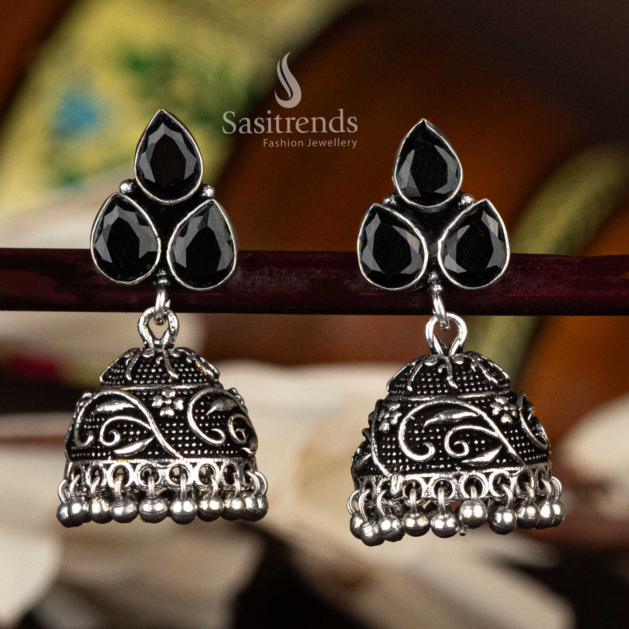 Oxidised silver floral jhumka earrings with black waterdrop stones and dome design - Sasitrends