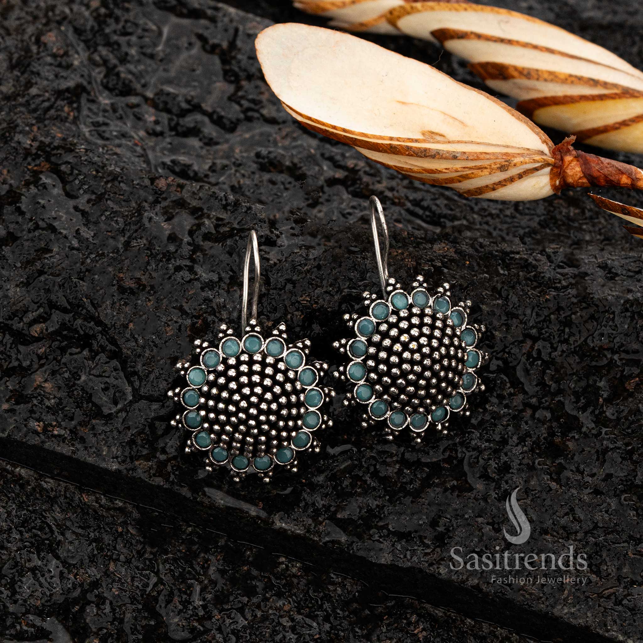 Close-up of oxidised silver earrings with Mint stones - Sasitrends