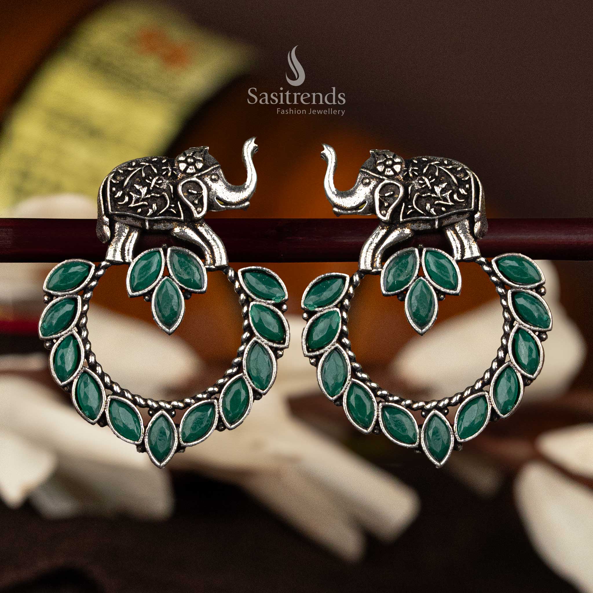 Green marquise stone oxidised silver earrings with elephant motif - Sasitrends