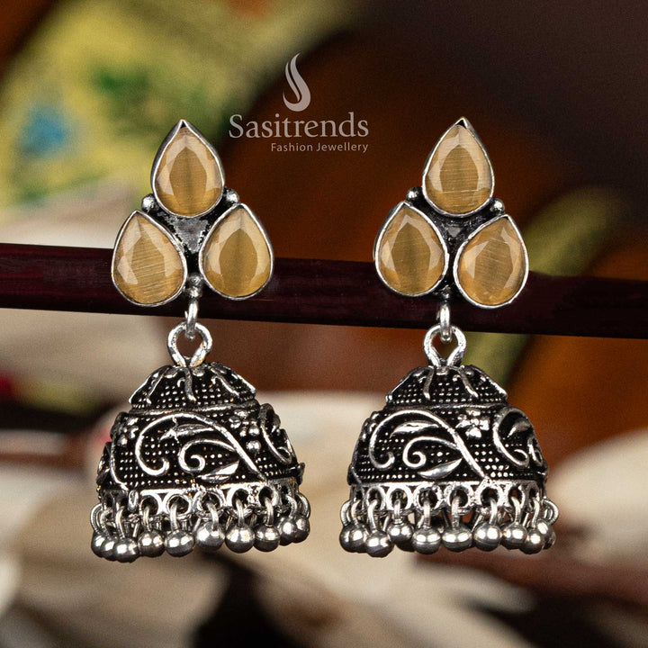 Oxidised silver jhumka with yellow waterdrop stones in floral leaf design and ball detailing - Sasitrends