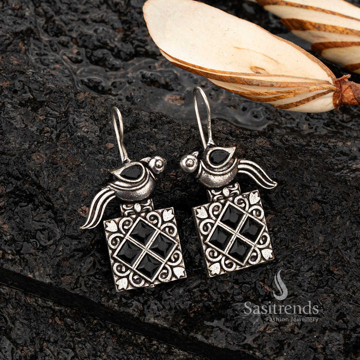 Black stone oxidised earrings featuring a perched parrot  - Sasitrends