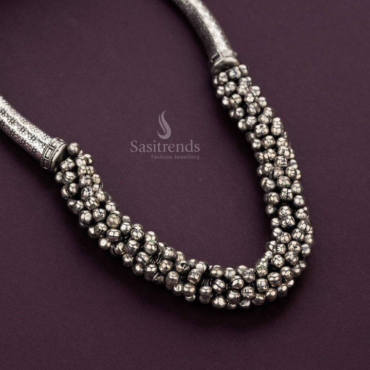 Close-up of oxidised silver necklace featuring ghungroo bead clusters - Sasitrends