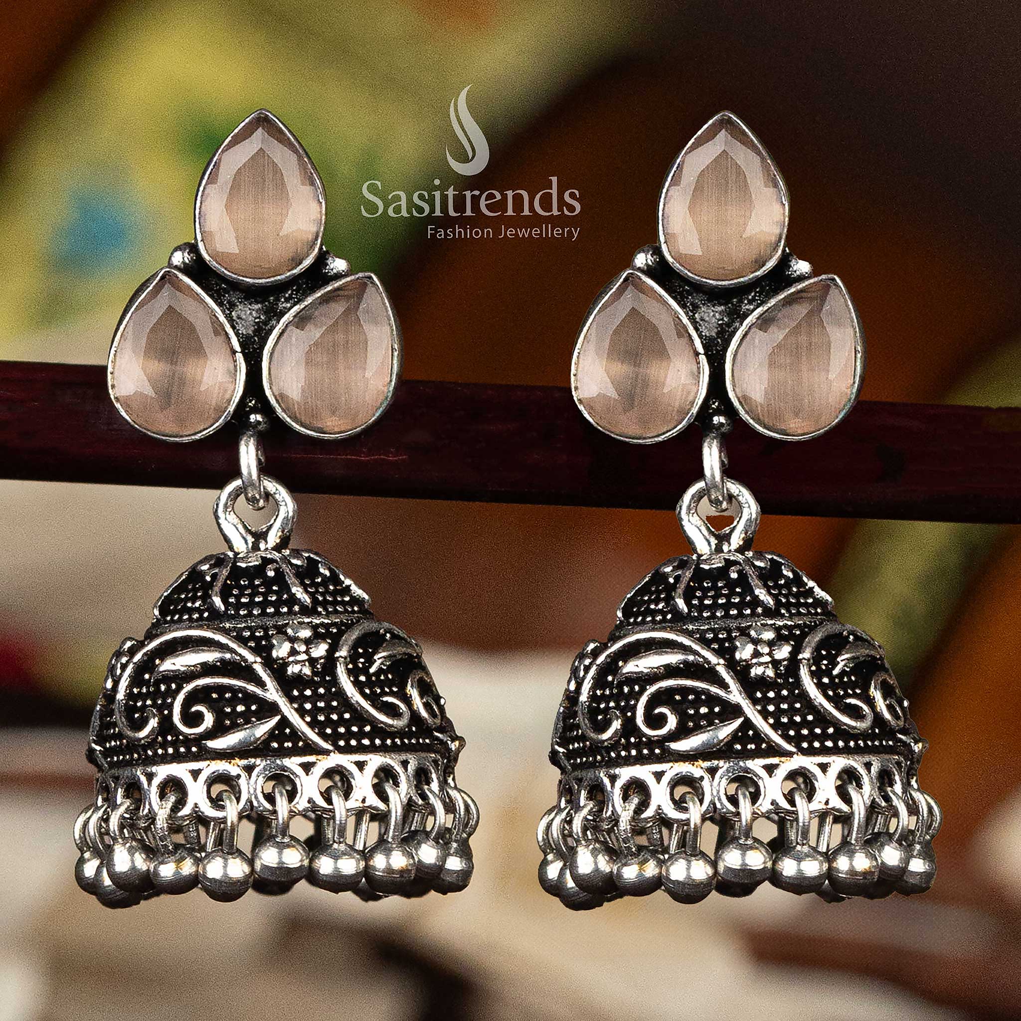 Brown waterdrop stone oxidised floral jhumka earrings with intricate design and bead tassels - Sasitrends