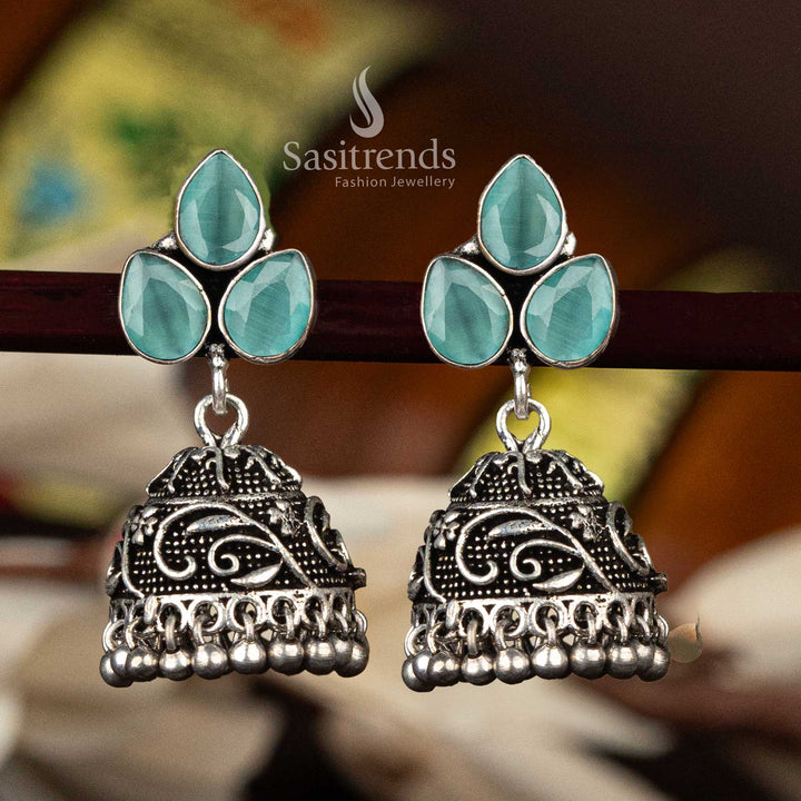 Elegant mint waterdrop stone oxidised floral jhumka with textured dome and ball fringe - Sasitrends