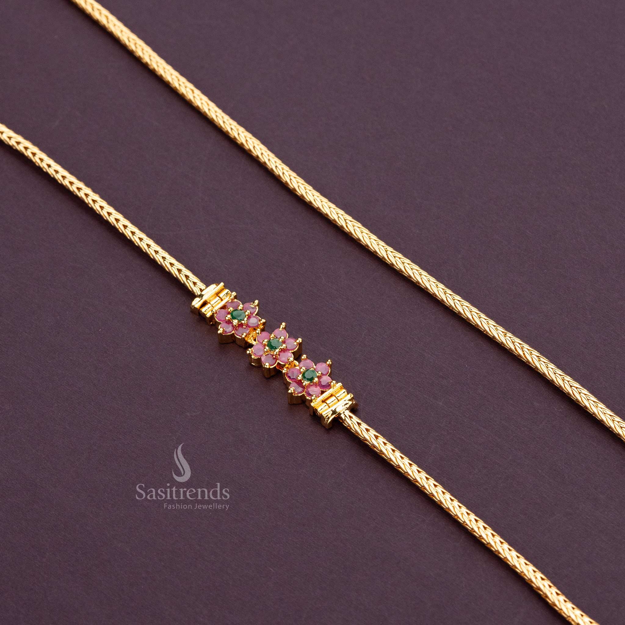 Micro gold-plated mugappu chain with ruby and green AD stone flowers, perfect for traditional wear - Sasitrends