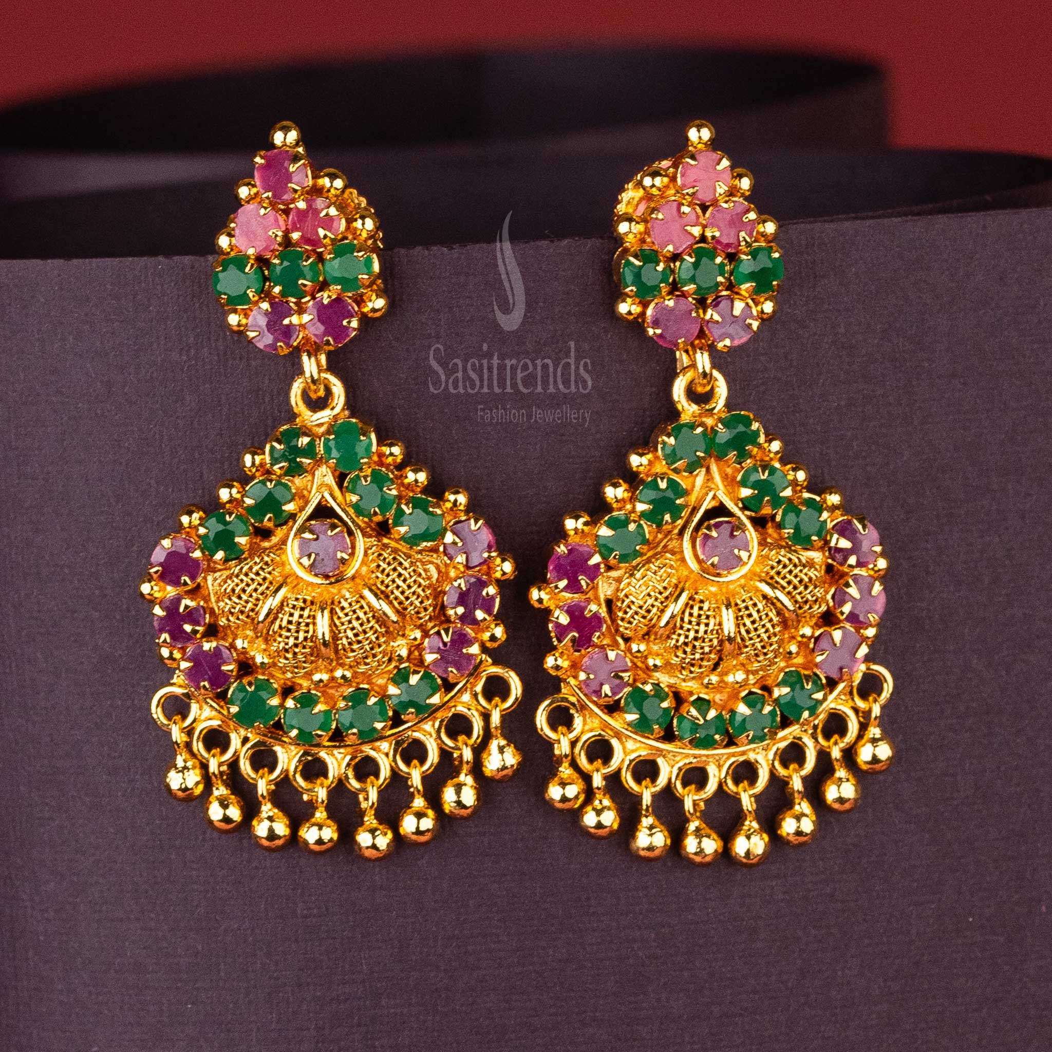 AD stone studded gold look alike earrings in ruby and green