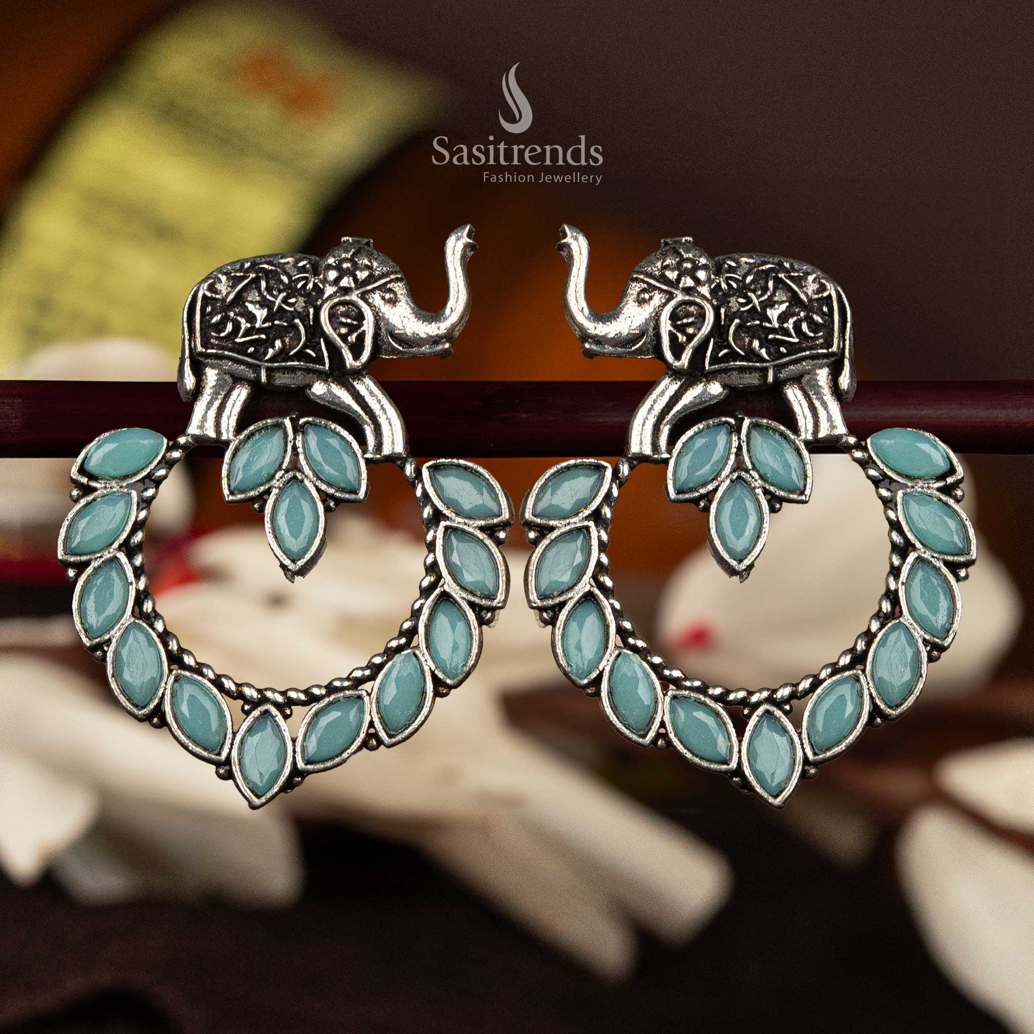 Mint marquise stone oxidised silver earrings with elephant motif - Sasitrends