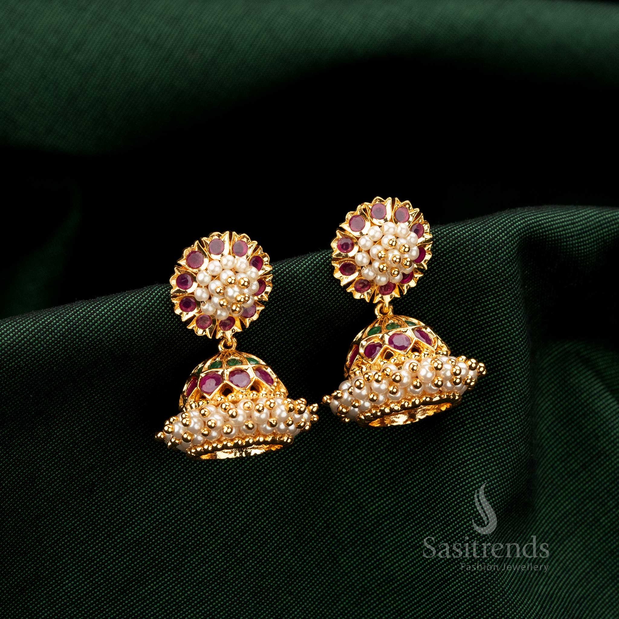 Luxury gold plated Jhumka earrings with traditional floral top, Ruby-Green AD stones, and full pearl dome, guaranteed real-gold-like appearance - Sasitrends