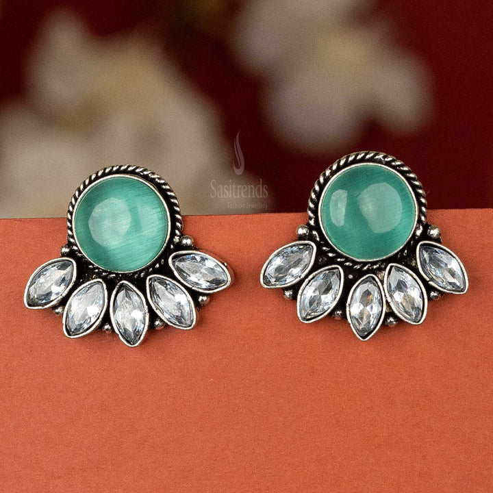 Trendy oxidised silver earrings with mint cabochon stone and AD stones