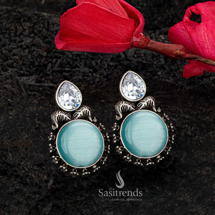 Soothing sky blue Monalisa stone earrings in oxidised silver with CZ leaf accents - Sasitrends





