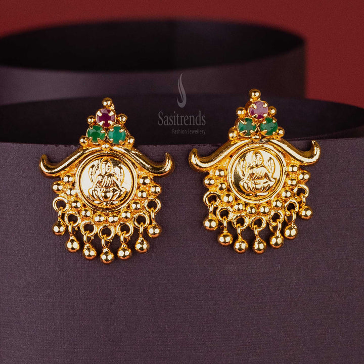 Lakshmi Motif Earrings with Three Ruby Green AD Stones and Swinging Golden Balls – South Indian Gold Look