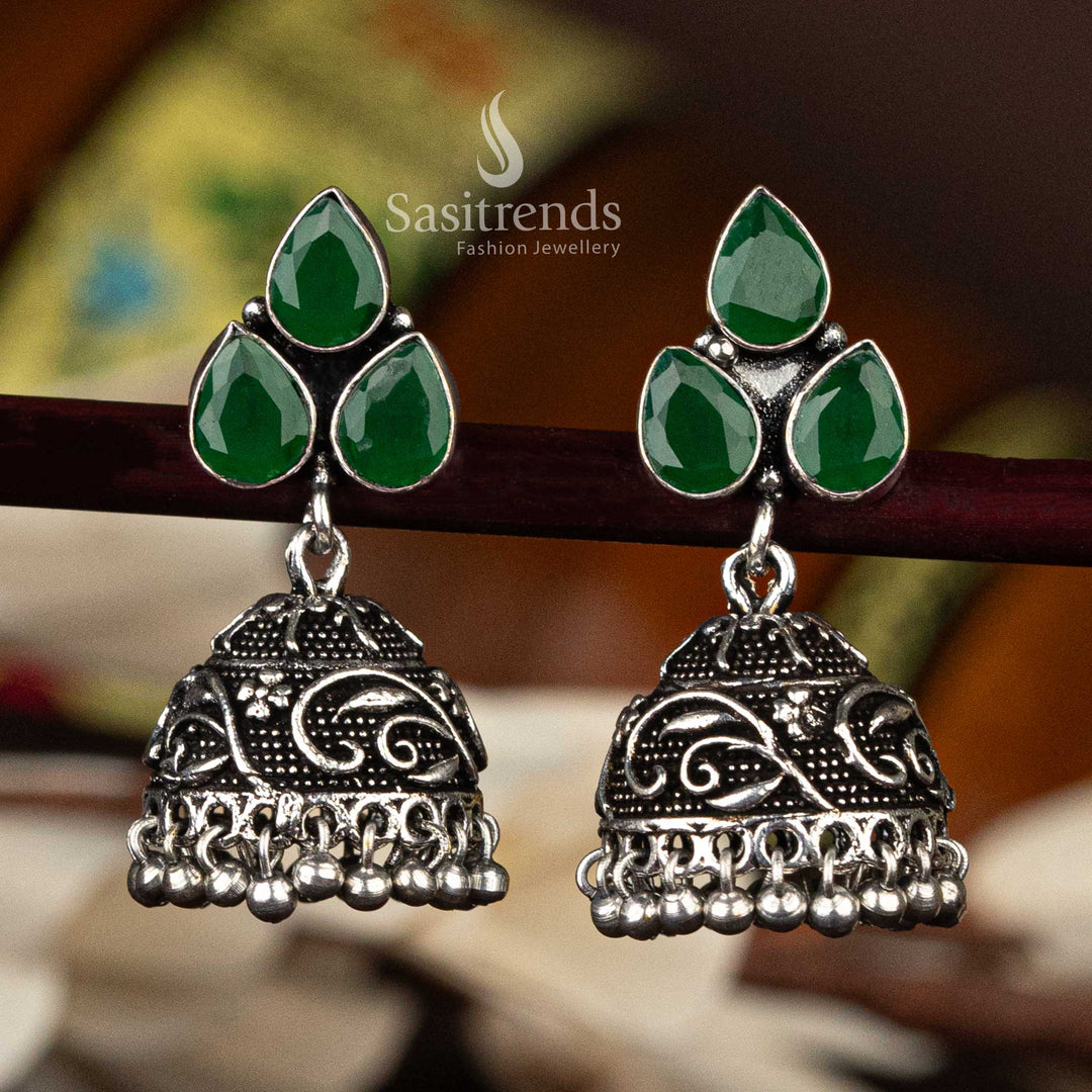 Green oxidised floral jhumka with intricate dome and waterdrop stones arranged in leaf shape - Sasitrends