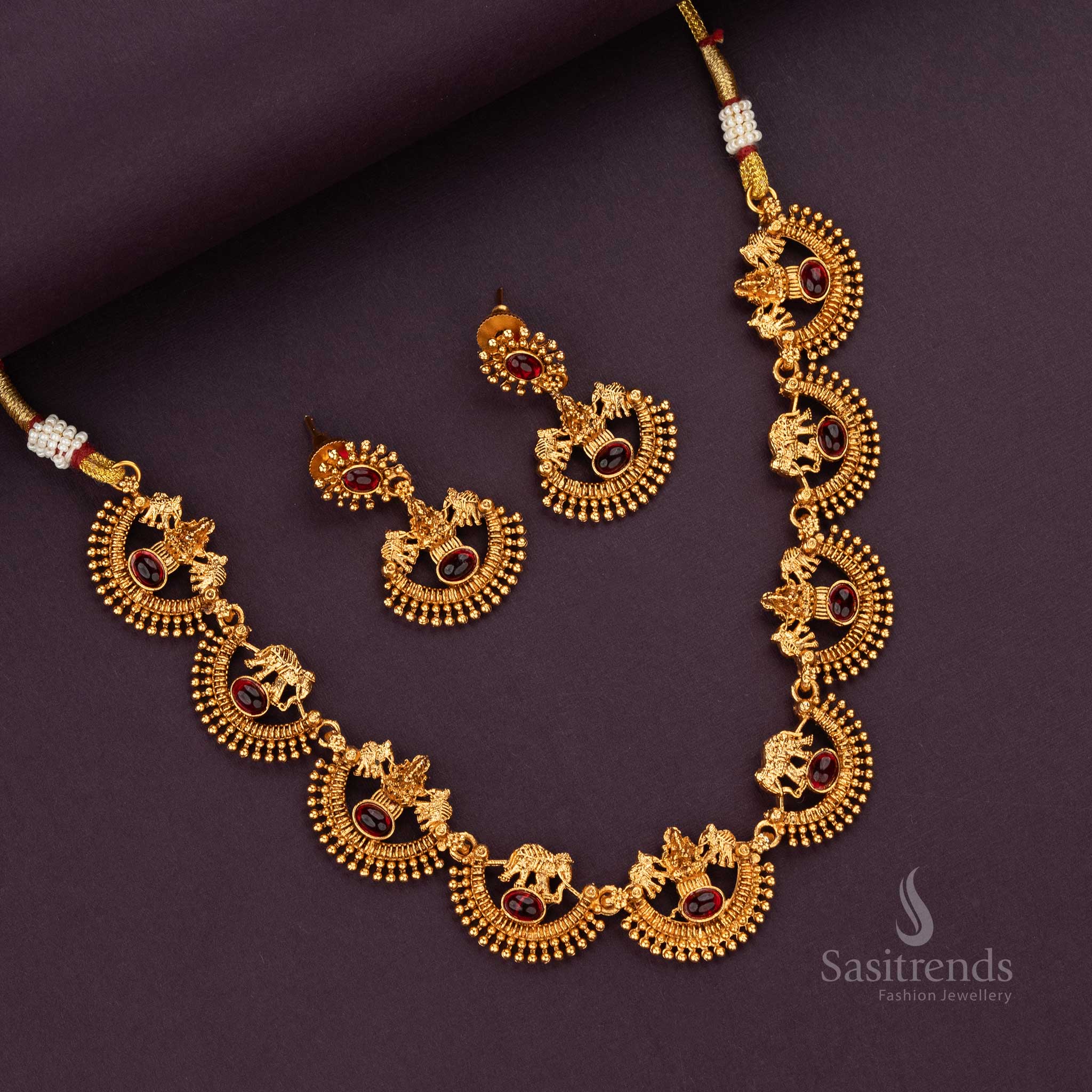 Ruby stone temple jewellery set with Lakshmi and elephant motifs - Sasitrends