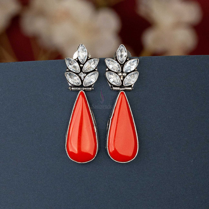 Chic oxidised silver earrings with Red cabochon stone and AD stones, perfect for casual outings.