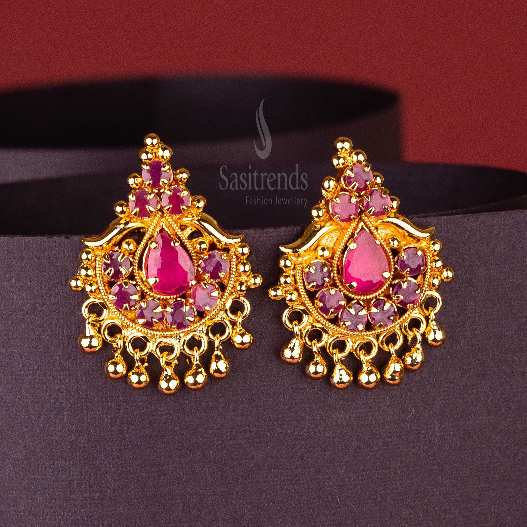 Classic Ruby AD stone earrings with golden ball hangings