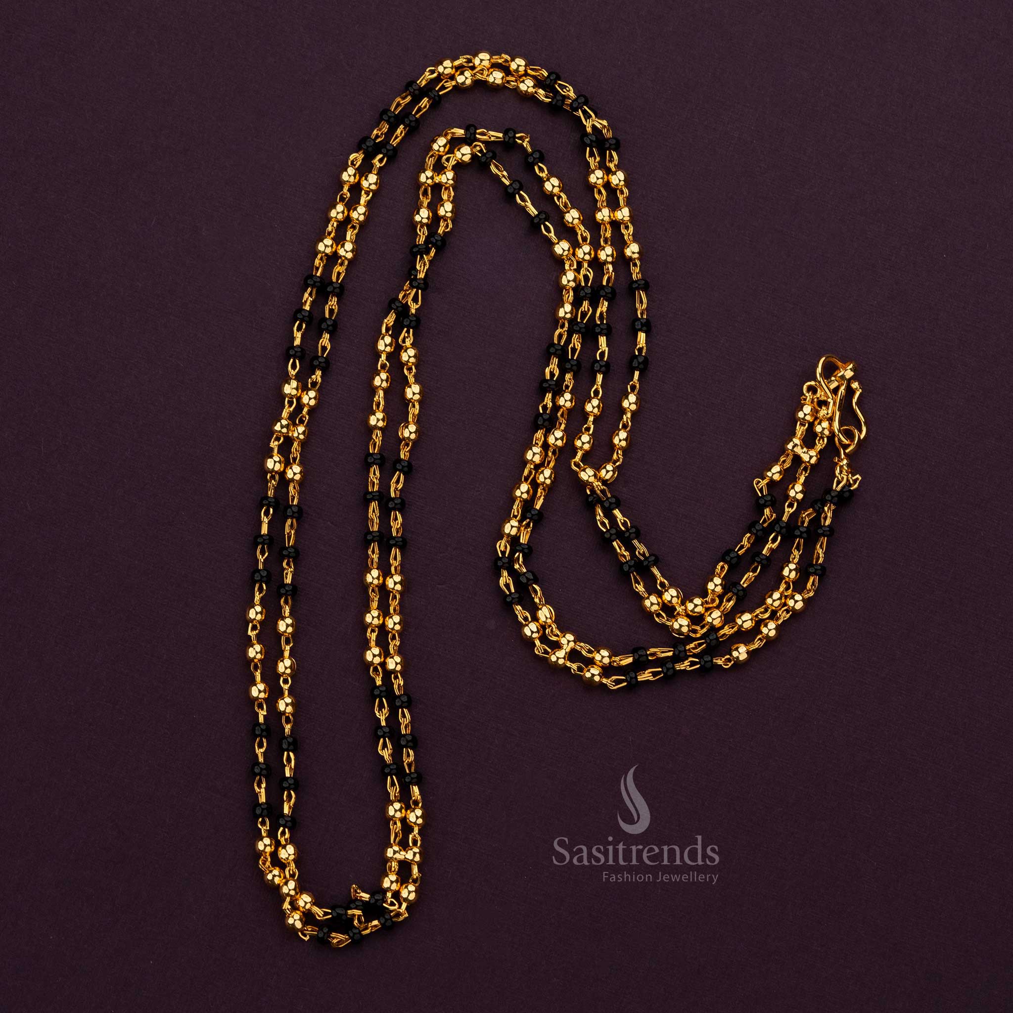 Micro gold plated chain adorned with vibrant black and gold beads, ideal for special events - Sasitrends