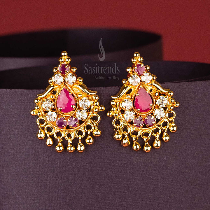 Ruby-White AD stone earrings with golden ball hangings