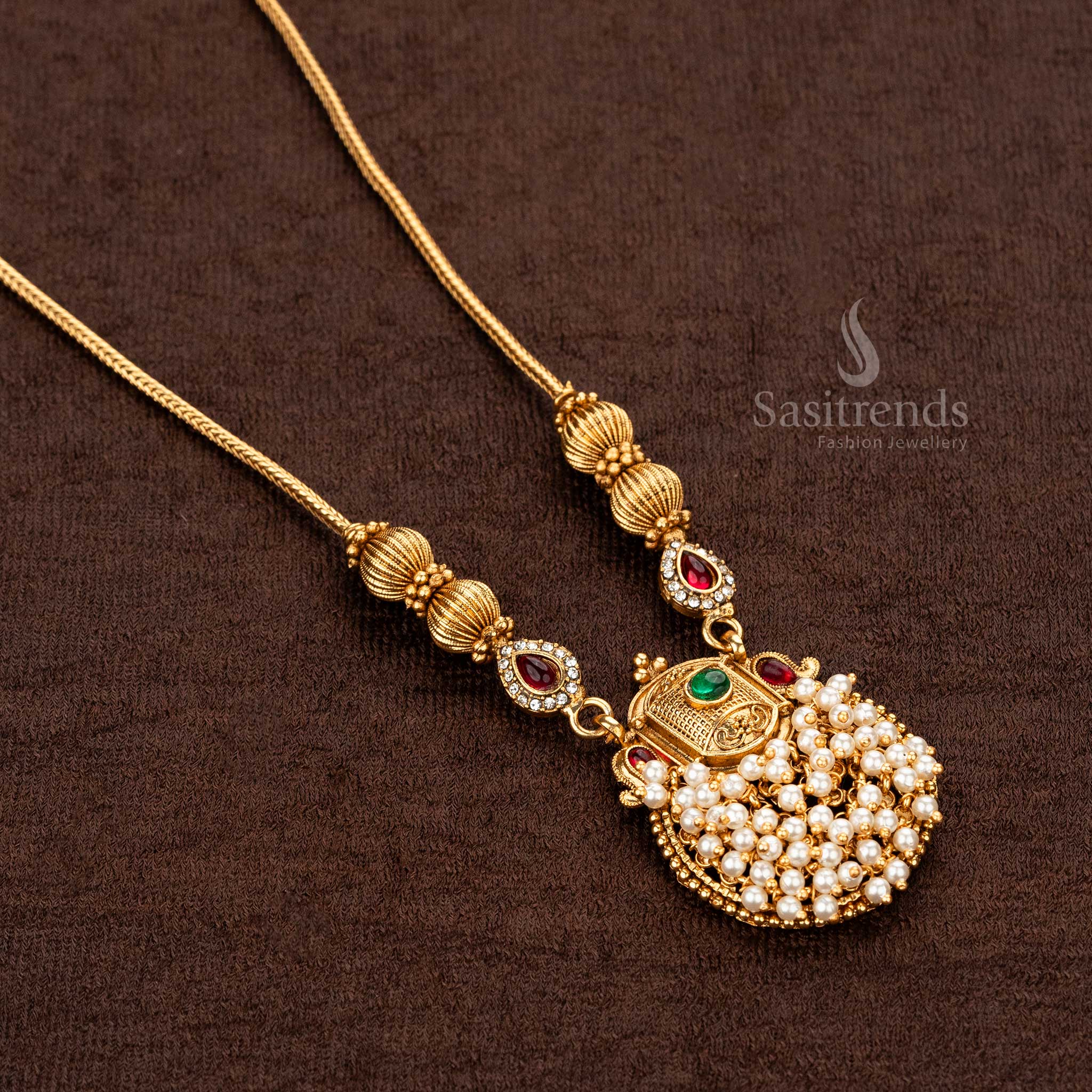 Stunning Temple pearl pendant necklace with green and ruby stones for festive wear - Sasitrends